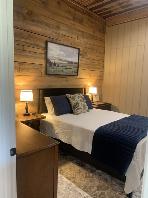 Second bedroom with access to the side porch.