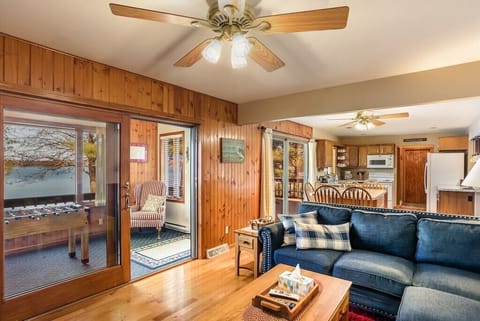 Living room with doorway to the sunporch overlooking the lake.