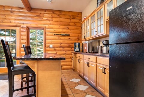 Game room with wet bar and 2nd refrigerator; Keurig, games, and more.