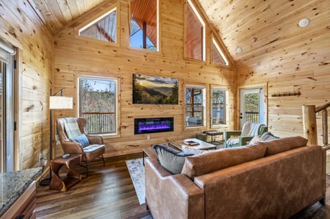 Sit on the comfy sofa and enjoy the views.  The fireplace provides ambiance.