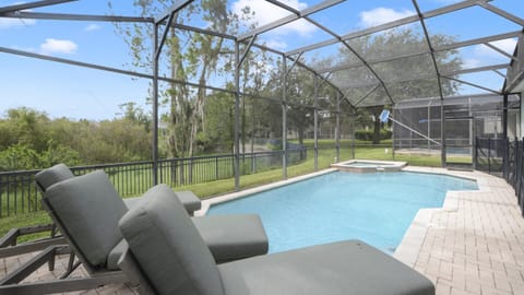 Pool and spa with stunning Florida conservation and lake view