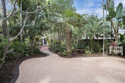 Parking space available right after the gate. Upon arrival, you will enter the property through a gate to the courtyard which boasts beautiful nature in the garden with a pond and exotic trees and flowers.