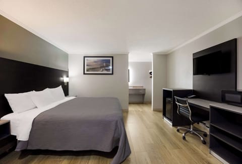 Room, 1 King Bed, Smoking | Laptop workspace, blackout drapes, iron/ironing board, cribs/infant beds