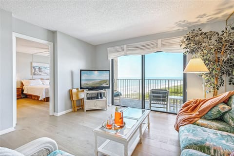 Bright & airy living room with a view of the waves and blue skies