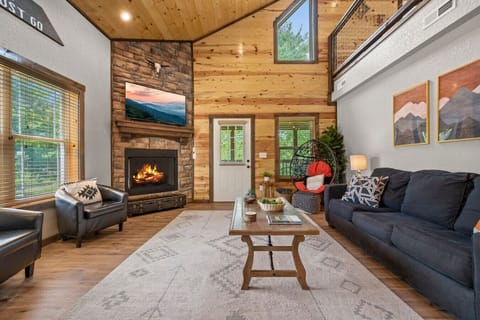 The inviting living room is a great place to relax and unwind. Enjoy movie night, or the big game, on the large Smart TV.