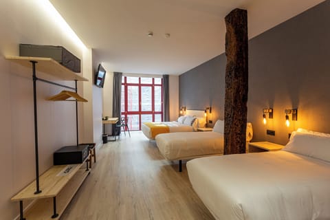 Family Quadruple Room, Balcony, City View | Memory foam beds, in-room safe, desk, laptop workspace