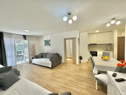 Family Apartment, Garden View | Living area | 32-inch LCD TV with cable channels