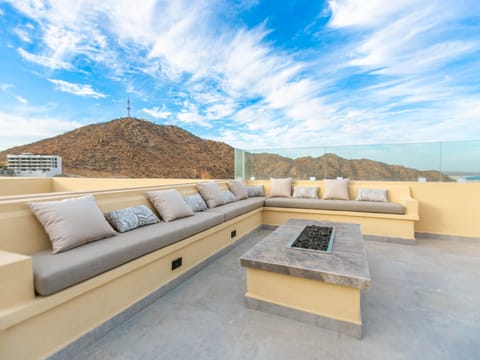 Unwind on the rooftop with a cozy fire pit and comfortable outdoor seating. The fire pit provides a warm, inviting atmosphere for evening relaxation or gatherings, while the plush seating lets you enjoy stunning views in comfort. This thoughtfully designed space is perfect for making the most of cool nights and savoring the breathtaking scenery.