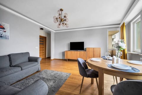 Comfortable Living Room with Sofa Bed and Smart TV | Book Now with RENTUJEMY