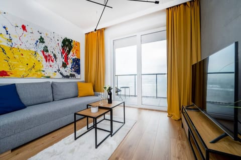 Living Room with Sofa Bed, Smart TV and Balcony | Book Now with RENTUJEMY.COM