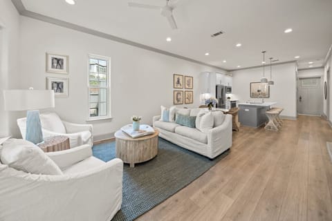 Living room with open floorplan and patio access
