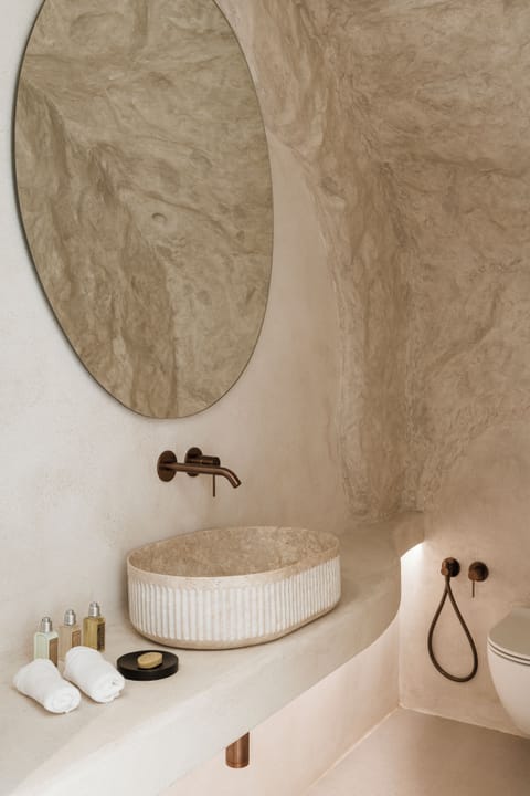 Cave Suite Caldera View with Private Pool | Bathroom | Shower, rainfall showerhead, hair dryer, bathrobes