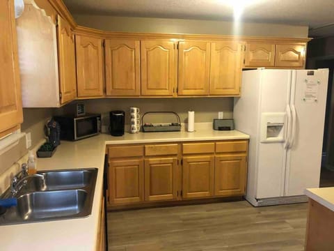 Kitchen with Keurig, microwave, dishwasher and all cooking necessities.