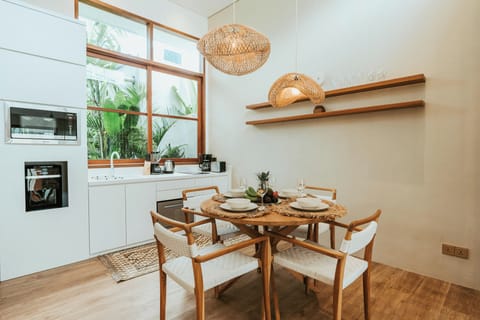 Open-plan kitchen with adjacent dining area, perfect for social meals.