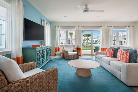 Inviting living space with a fusion of comfort and modern coastal aesthetics.
