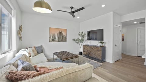 Gather and relax. Curl up on the comfortable couches and enjoy a movie night on the Smart TV in the living room.