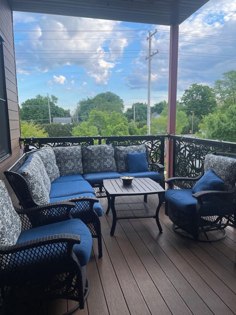 Spacious deck with ceiling fan and grill