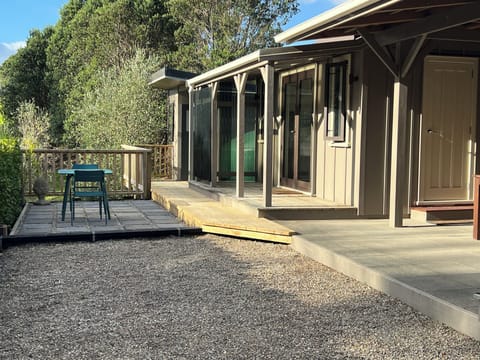 View of Cabin 2 and separate bathroom with shower and sink at end of photo.