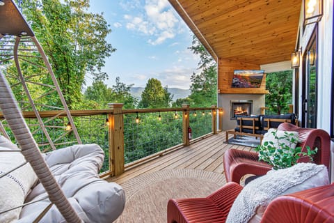 Unwind on your private deck, lounging by the outdoor fireplace, and take in the stunning mountain scenery.