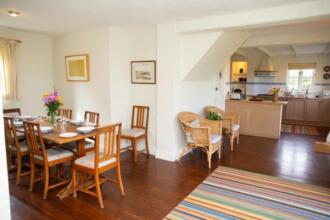 Dining area with table and chairs and view of kitchen