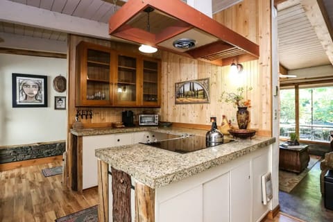 Kitchen features flat top cook stove and all the amenities you need.