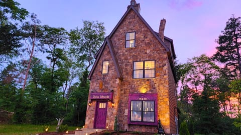 Three Wizards towers at 3 stories, has a crooked chimney & a "storefront" window