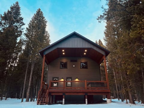 Back of the house with the back beck and hot tub 