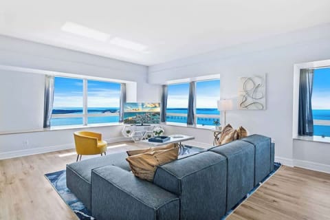 Inviting Living Area of the Condo in Miami Florida - Cozy and inviting atmosphere with warm tones - Cozy Sofas - Well-planned layout maximizing comfort and functionality - Smart TV and Netflix