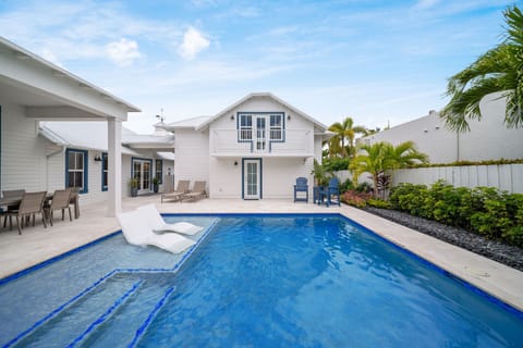Heated pool with submerged loungers