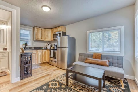 Bright open-concept living and kitchen space with modern comforts—perfect for cooking, relaxing, and enjoying a stylish, cozy stay after a day of exploring!