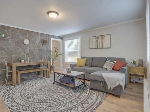 Stretch out and relax in our spacious living room! Plenty of comfy seating for everyone to unwind after a day of fun. Book your comfortable gathering space!