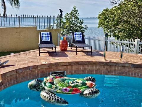 Relax by the private pool with view of the river