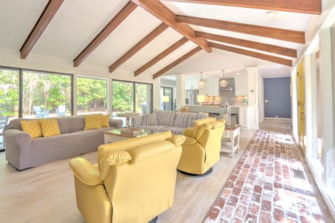 Living Room with Flat Screen TV and Pool Views