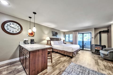 Your cozy retreat features a king bed, kitchenette, and crackling fireplace—perfect for romantic evenings in this thoughtfully designed space.