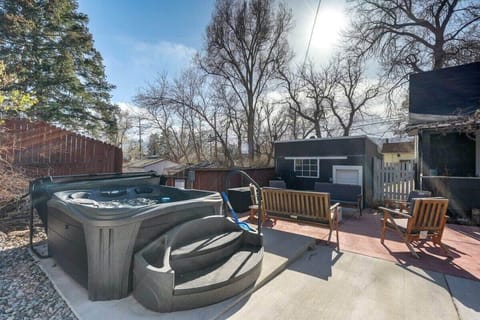 Sink into the hot tub on the wood deck, then kick back in the Adirondack chairs while bare trees frame the sky—your easy outdoor wind-down spot.