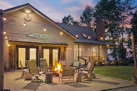 Woodland Lodge sleeps up to 18 guests and features a game room, theater room, hot tub, fire pit, and 8 private wooded acres in the heart of Hocking Hills.