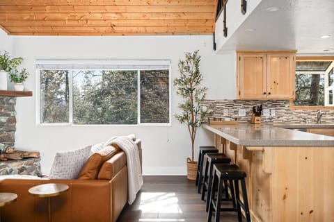 Large windows bring in lots of light and invite in the views of the surrounding trees and some of the most colorful sunsets!