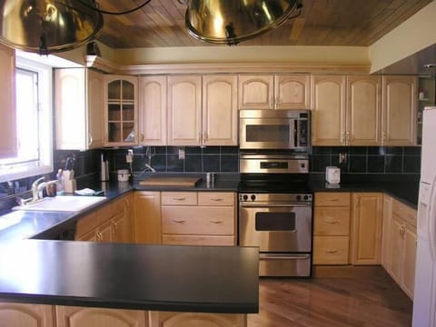 Signature Cabin, 4 Bedrooms, Mountain View | Private kitchen | Fridge, microwave, coffee/tea maker, cookware/dishes/utensils