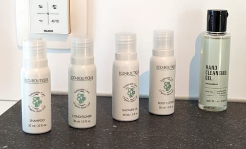 Shower, rainfall showerhead, hair dryer, towels