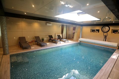 Indoor pool, seasonal outdoor pool, pool umbrellas, sun loungers