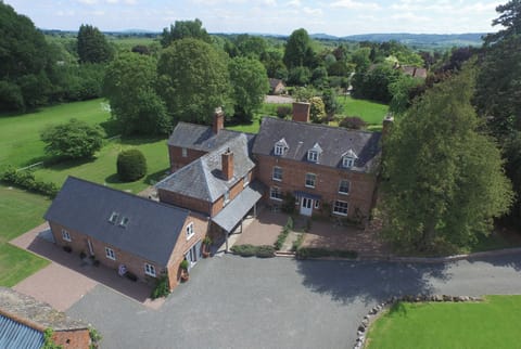 An overview of Monnington House Garden Cottage, The Cider Mill in distance 