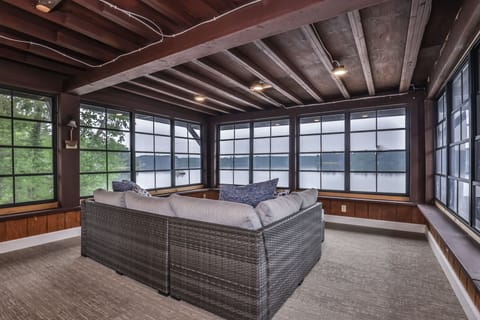 Beautiful open screened in porch area over looking the lake