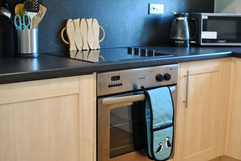 The kitchen is modern has plenty space to cook