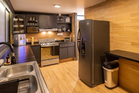 A fully equipped kitchen with modern appliances—perfect for home-cooked meals during your stay.