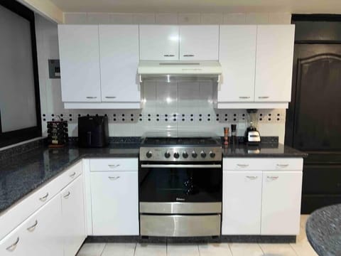 Cook like at home in a fully equipped kitchen with modern appliances and plenty of counter space.