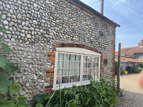 Kitchen window to the side bins to the rear
