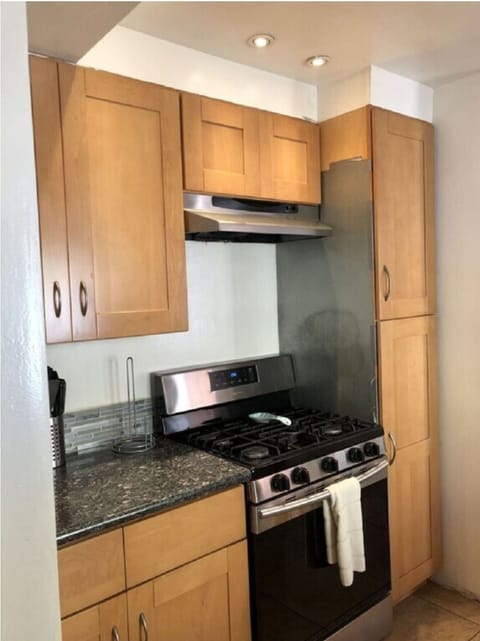 Granite, wood,  and all stainless steel appliances. Bosch stove, lots of counter