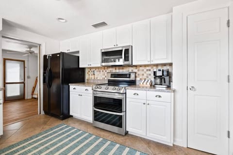 Fully stocked kitchen- a second refrigerator is located in the laundry room