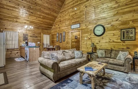 Living Room: Spacious and inviting with rustic charm, perfect for relaxing and unwinding together!