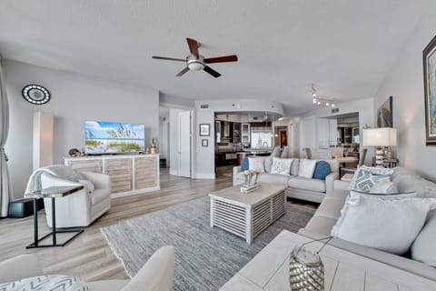 Light and airy living space featuring coastal-inspired decor and a seamless flow between the living and dining areas.